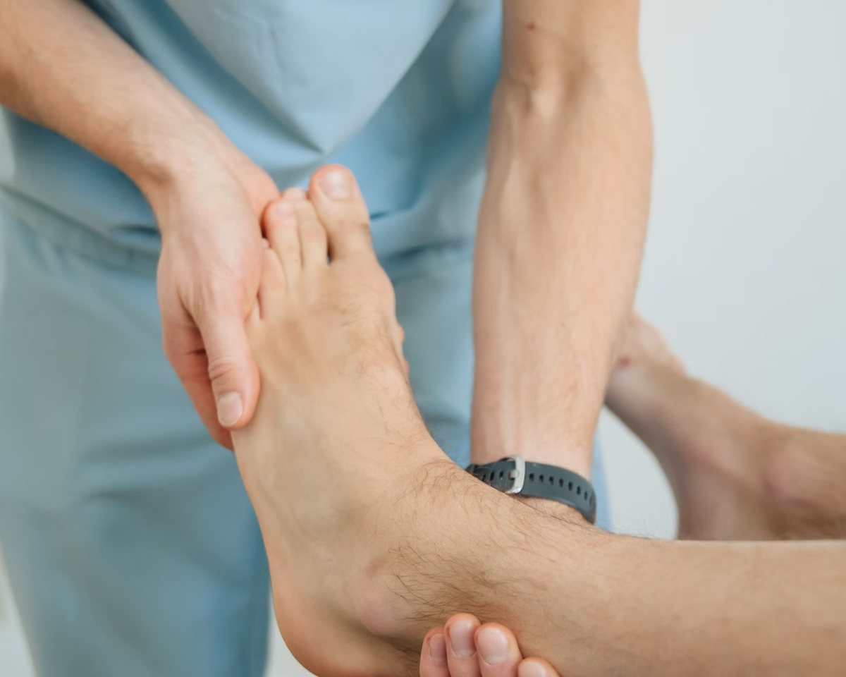 Practitioner assessing a patient's foot and ankle